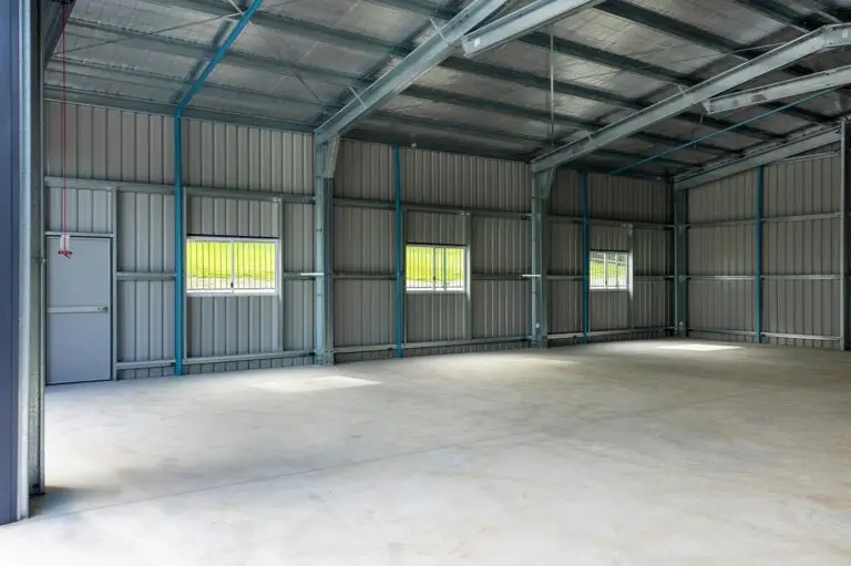 Interior of caravan and boat storage shed with windows, steel framing, and insulated roof.