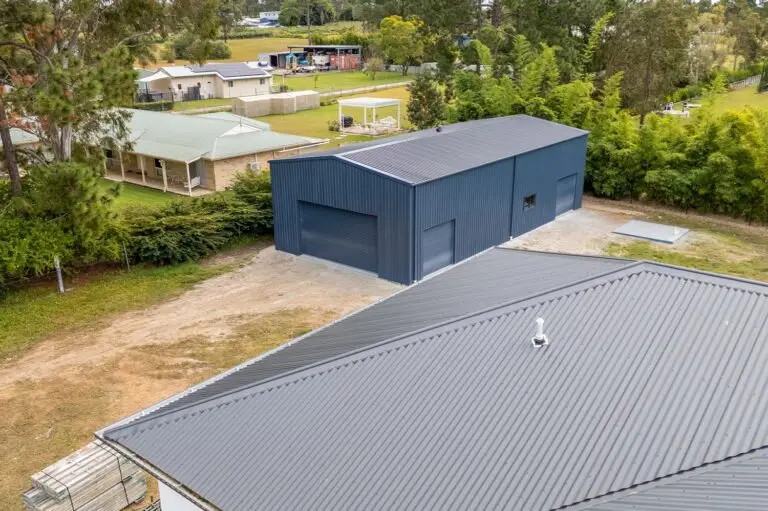 Custom workshop shed in Forestdale built beside new home with matching roof