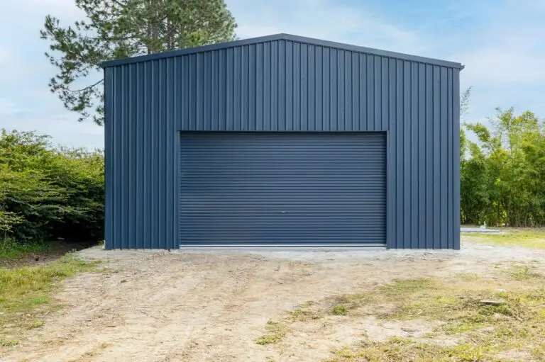 Front view of epoxy floor workshop shed in Forestdale with wide roller door access